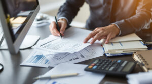 A client meeting with one of the best tax accountants to review documents and maximize deductions.